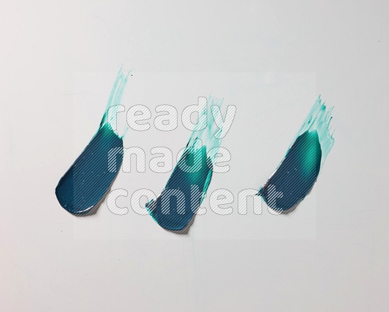 Turquoise painting knife strokes on white background