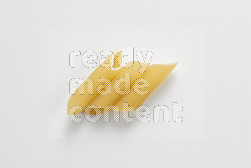 Penne pasta on white background