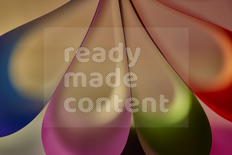 An abstract art piece displaying smooth curves in colorful gradients created by colored light