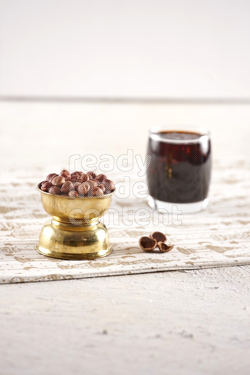 Nuts in a metal bowl with tamarind in a light setup