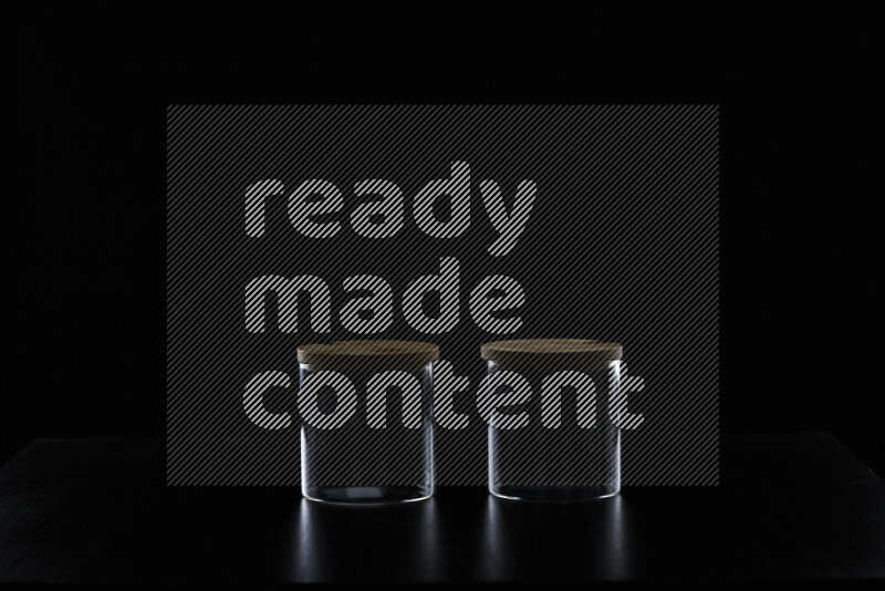 Glassware with rim light against black background