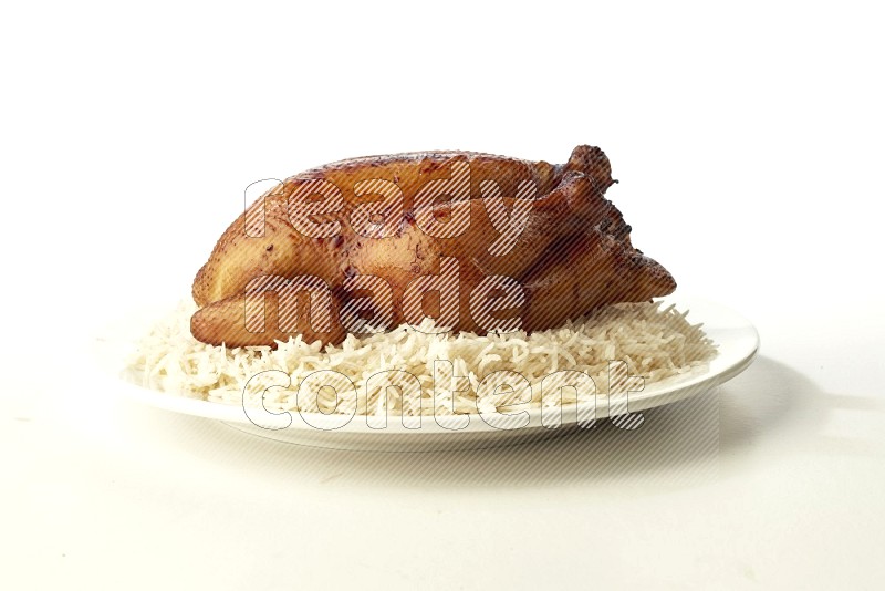 white  basmati Rice with  whole roasted chicken  on a white rounded plate direct on white background