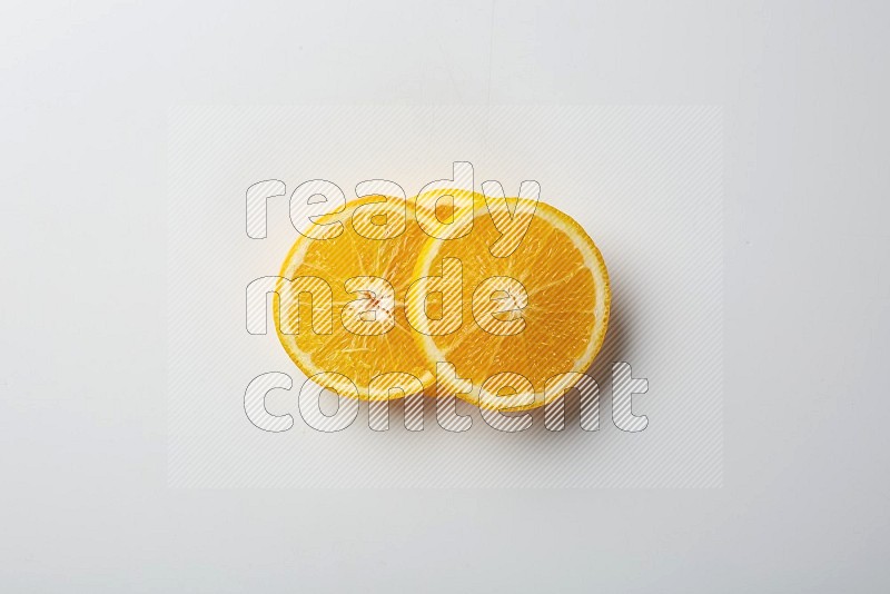 Three orange slices on a white background