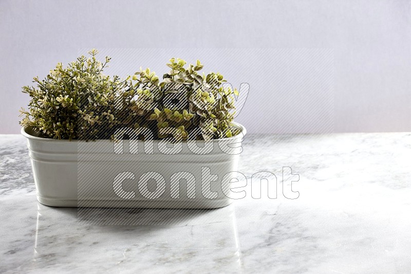 Multiable Artificial Plants in White Pot on Light Grey Marble Background 45 degree angle