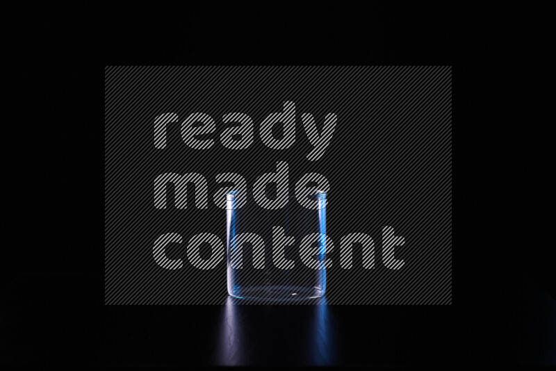 Glassware with rim light in blue and white against black background