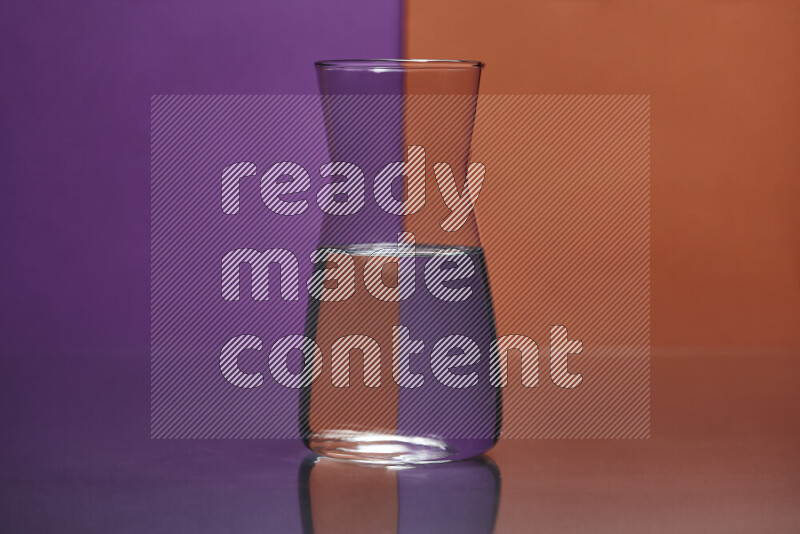 The image features a clear glassware filled with water, set against purple and dark orange background