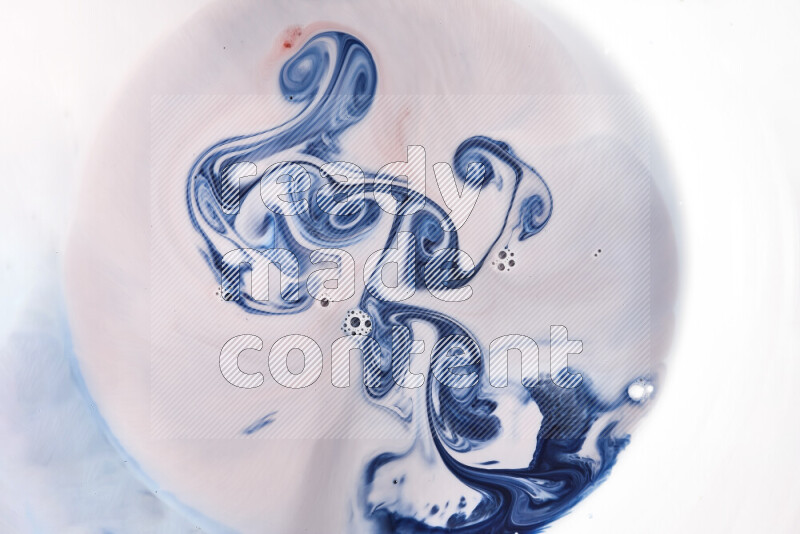 A close-up of abstract swirling patterns in blue, red and white