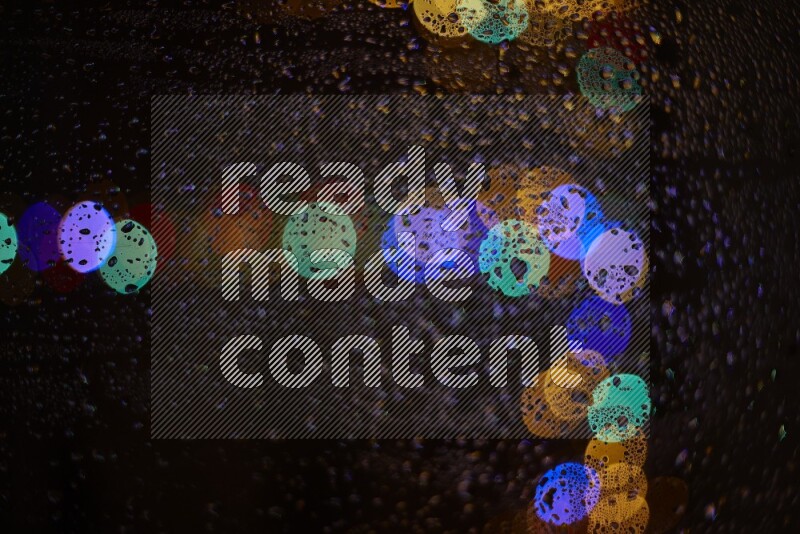 Bokeh light in multicolor with water drops