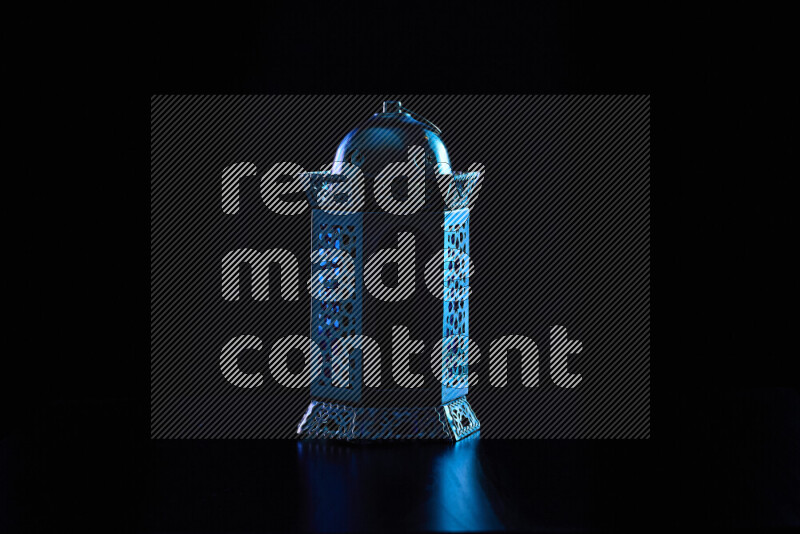 Ramadan lanterns with colored rim light against black background