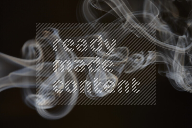 Motion of wavy smoke isolated on dark background