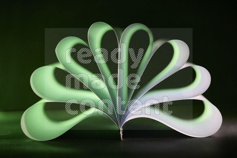 An abstract art piece displaying smooth curves in green and white gradients created by colored light