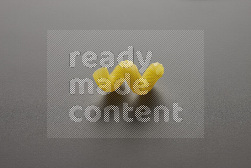 Twist pasta on grey background