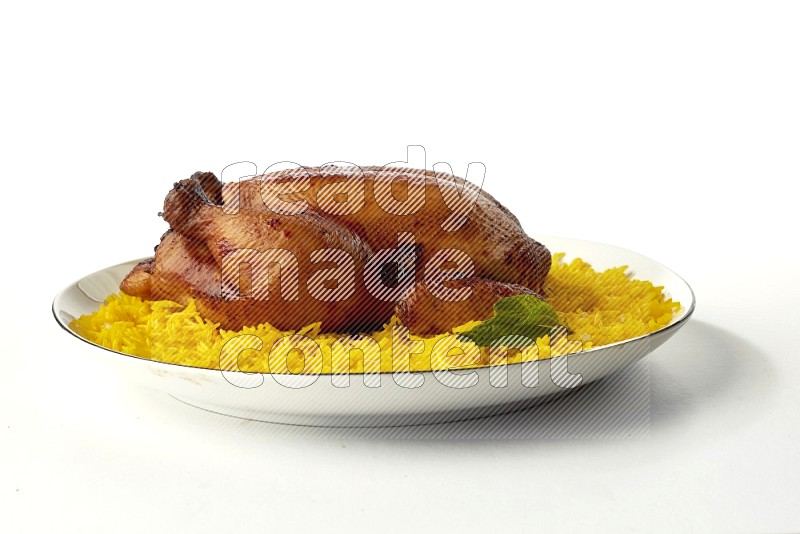 yellow  basmati Rice with kabsa chicken pieces on a white plate with a silver rim direct on white background