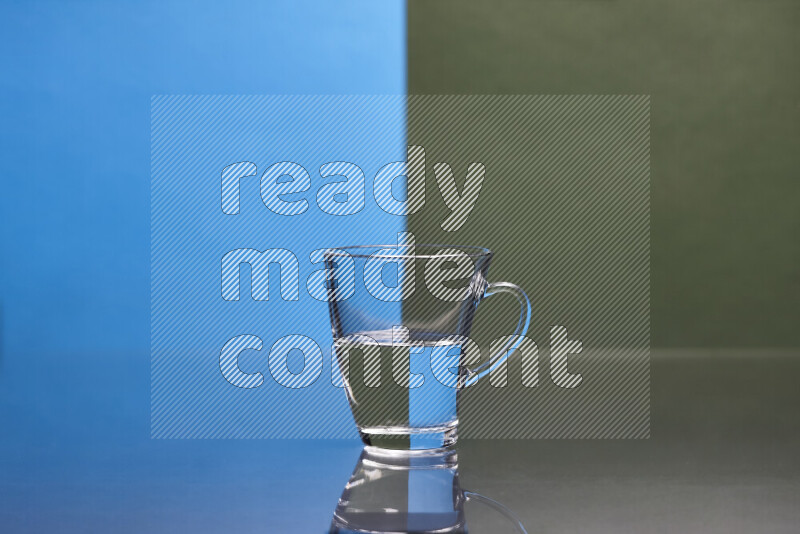 The image features a clear glassware filled with water, set against blue and dark green background