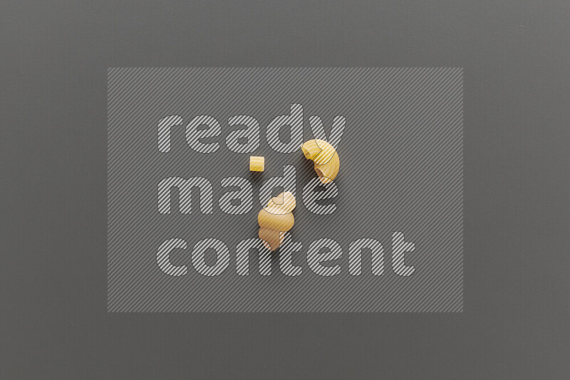 Different pasta types on grey background