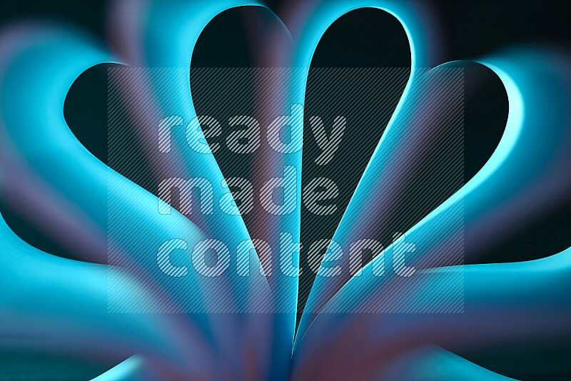 An abstract art piece displaying smooth curves in blue gradients created by colored light