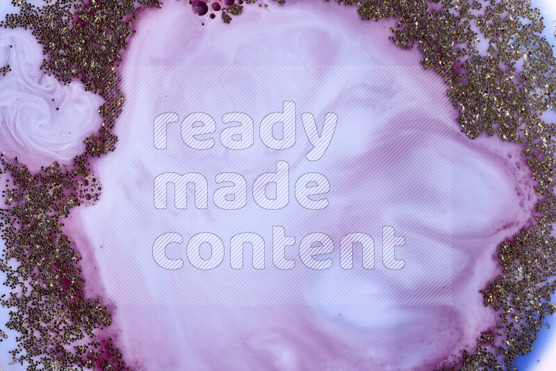 لقطة مقربة لبريق ذهبي متلألئ منتشر على خلفية من اللون الأزرق والأحمر في حركات دائرية