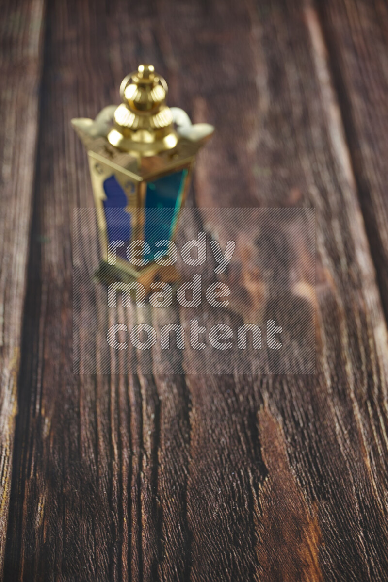 A lantern placed on a wooden background