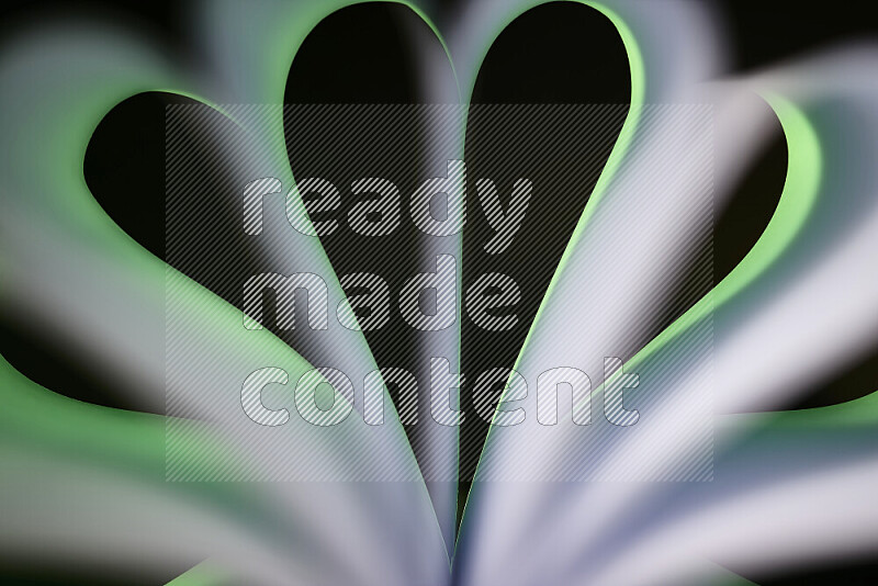 An abstract art piece displaying smooth curves in green and white gradients created by colored light