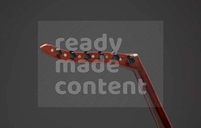 parts of a brown wooden Oud in a gray background