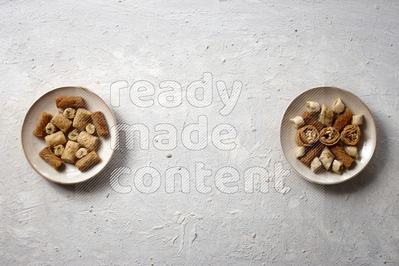 Oriental sweets in pottery plates in a light setup