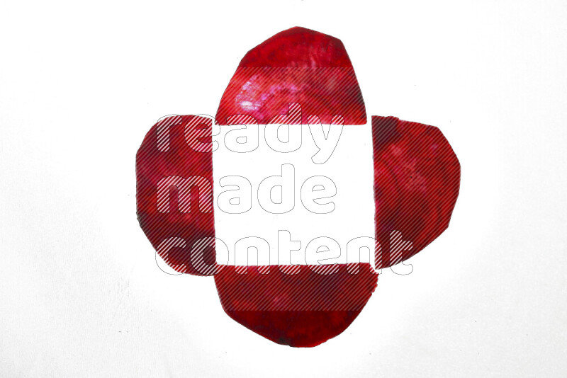 Beet slices on illuminated white background