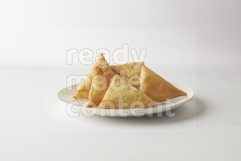 sambosas on a white background