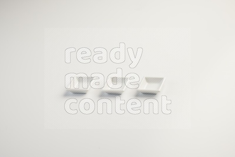 white ceramic square sauce dish on white countertop