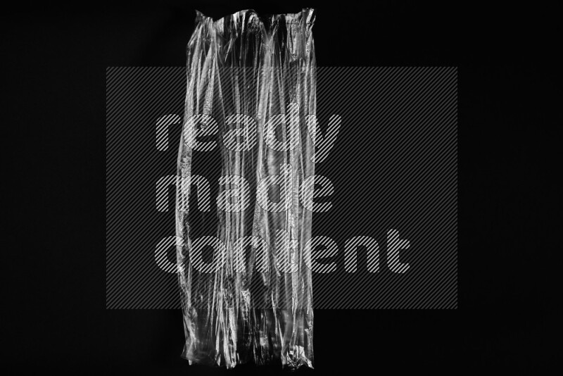 Transparent plastic textures on black background