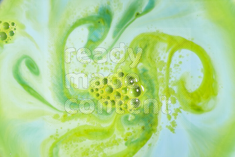 A close-up of abstract swirling patterns in green gradients