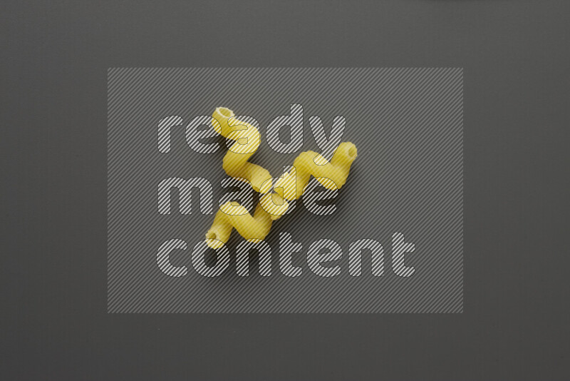 Twist pasta on grey background