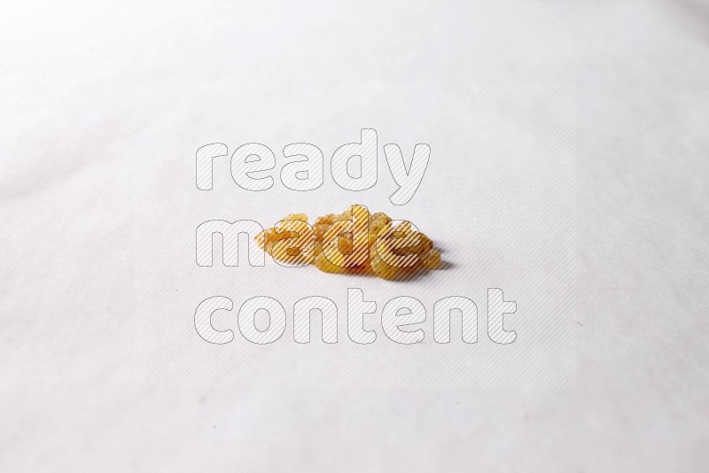 Raisins on white background