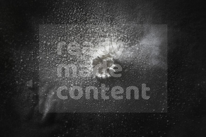 White powder explosion on black background