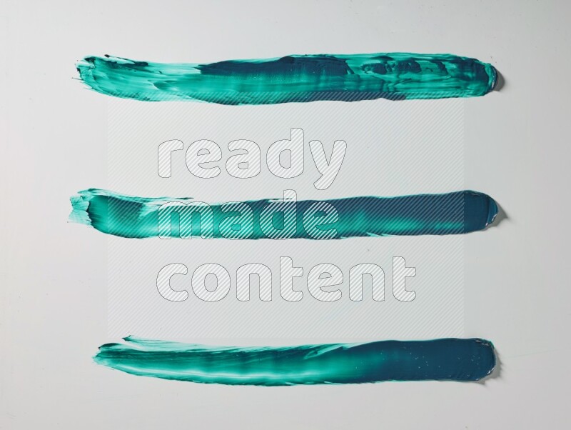 Turquoise painting knife strokes on white background
