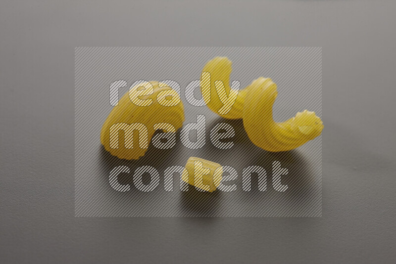 Different pasta types on grey background