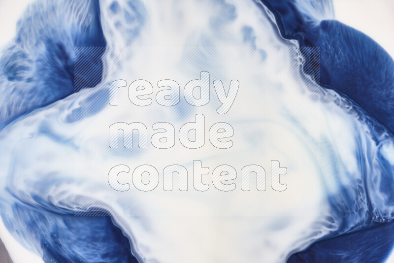 لقطة مقربة لأنماط دوامية باللون الأزرق والأبيض