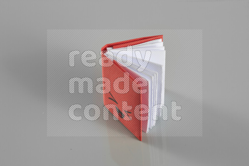 Origami book on grey background