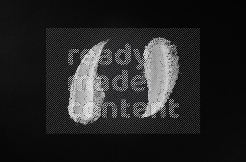 Blue powder strokes on black background