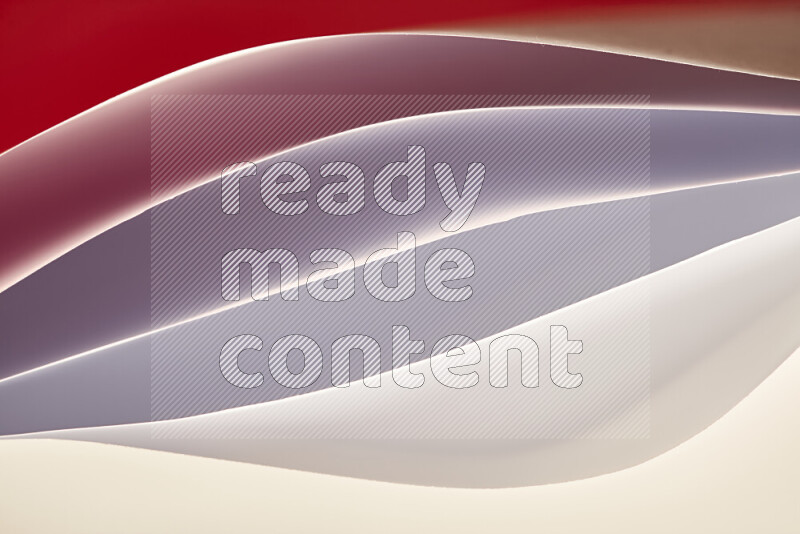 This image showcases an abstract paper art composition with paper curves in white and different warm gradients created by colored light