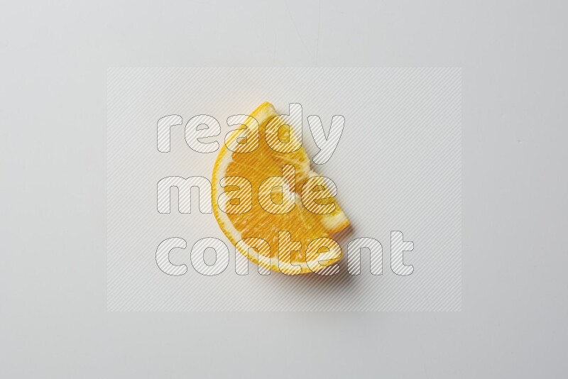 Two halves of an orange slices on white background