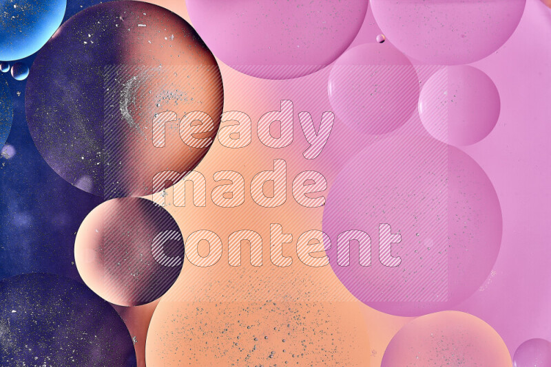 Close-ups of abstract oil bubbles on water surface in shades of blue, orange and pink