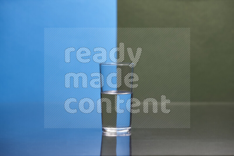 The image features a clear glassware filled with water, set against blue and dark green background