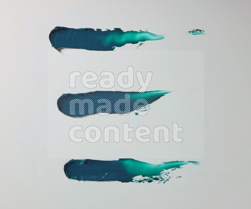 Turquoise painting knife strokes on white background