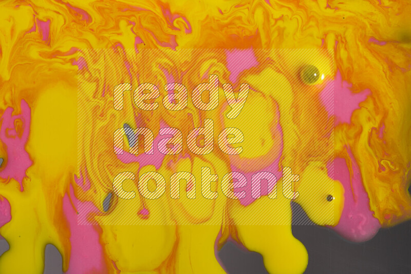 Abstract colorful background with mixed of pink and yellow paint colors