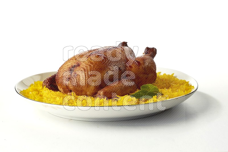 yellow  basmati Rice with kabsa chicken pieces on a white plate with a silver rim direct on white background