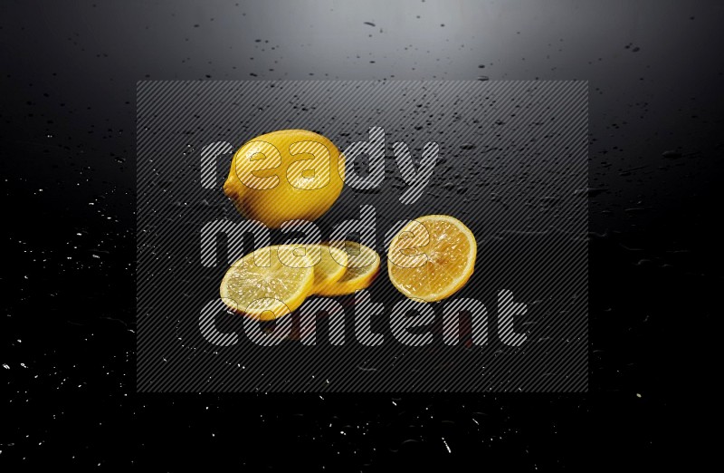 Lemon slices with water drops, and droplets on black background