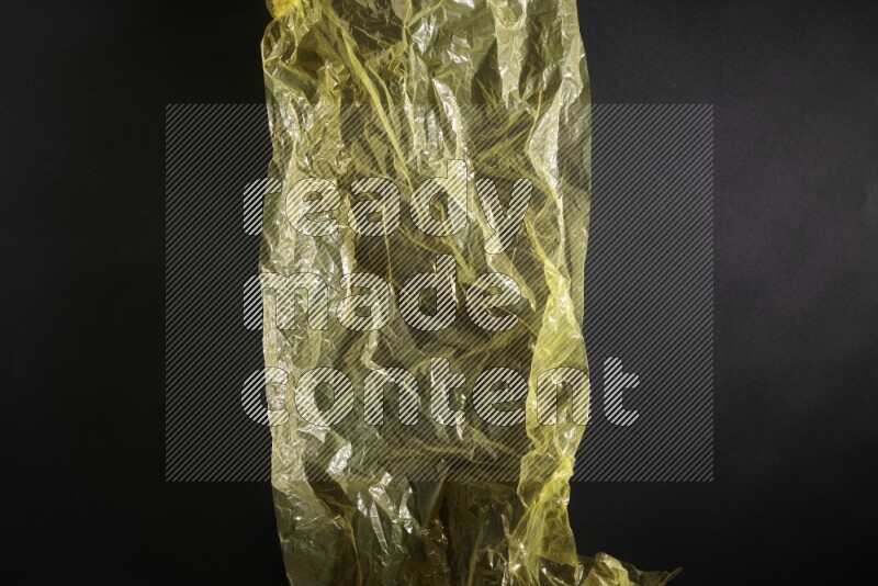 Colored plastic textures on black background