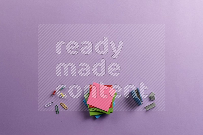 Multicolored sticky notes with school supplies on purple background (Back to school)