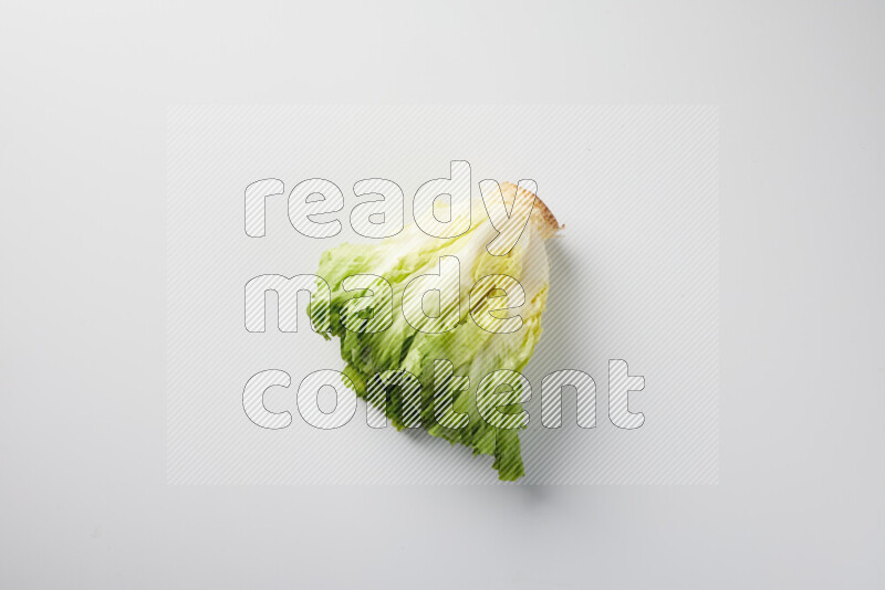 A fresh head of lettuce with green leaves on white background
