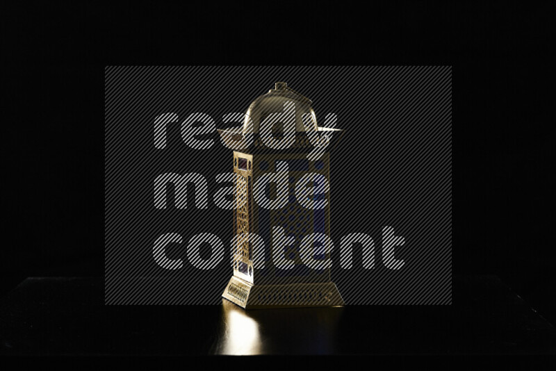 Ramadan lantern with rim light against black background